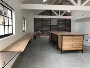 Custom workstations, conference table, and shelves